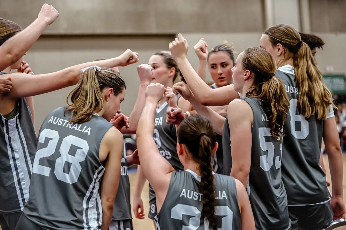 AUSA Hoops coach mentoring a player during a game