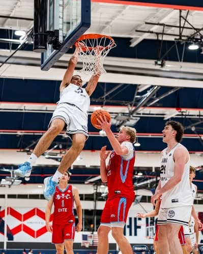 AUSA Hoops athlete throwing down a dunk on opening day in the United States
