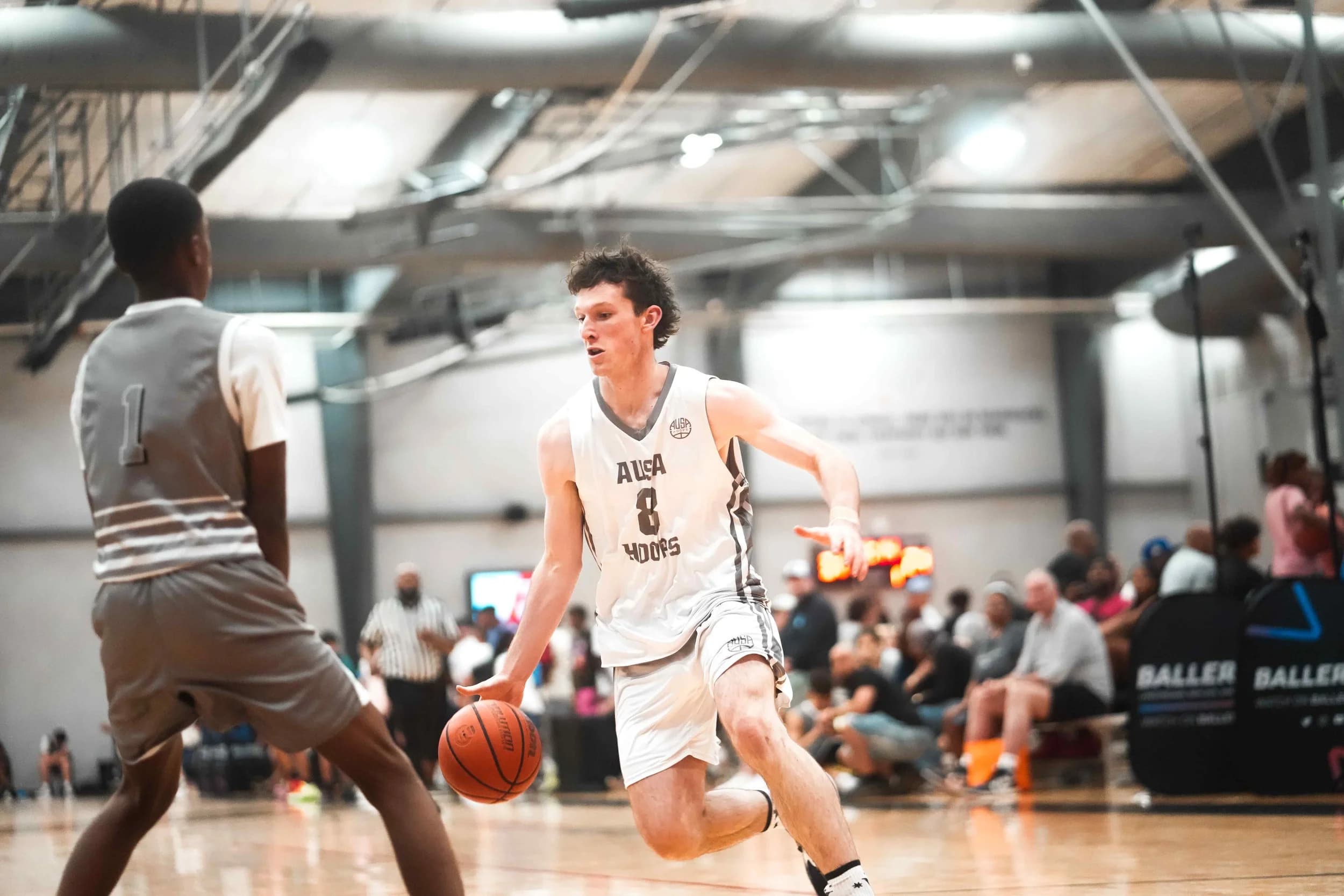 An AUSA Hoops player driving to the basket at a US tournament