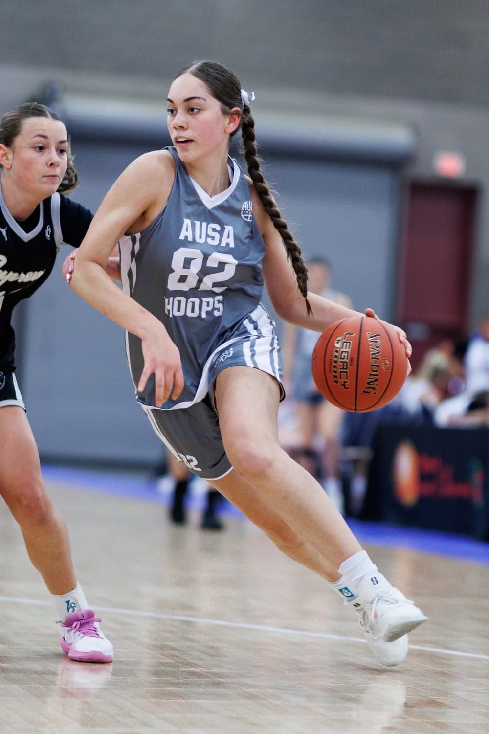 AUSA Hoops guard driving past her defender at a US tournament