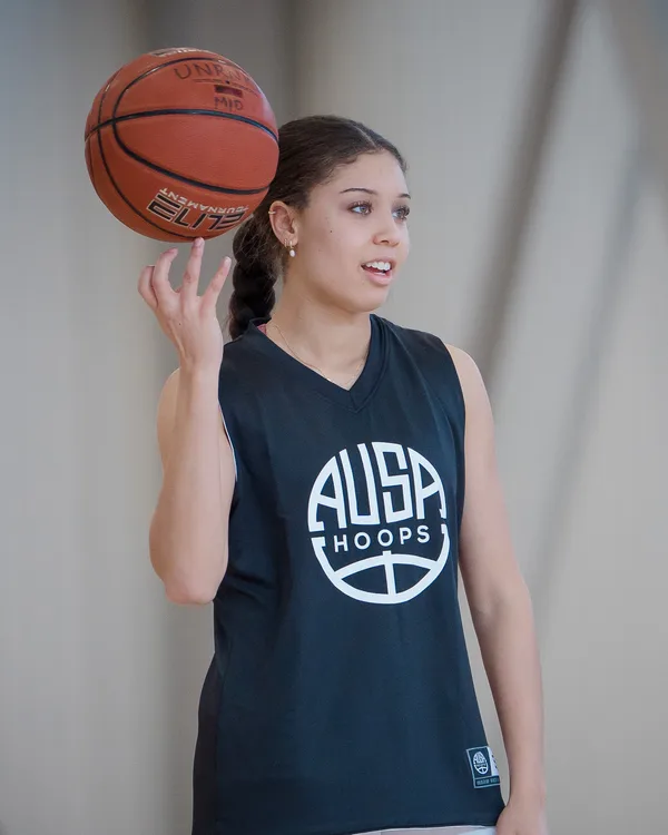 AUSA Hoops player spinning a basketball on her finger at a trial session